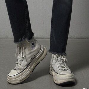 Distressed Converse High-Top Sneakers in Cream